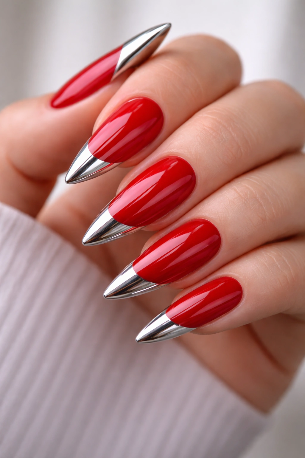 Fire engine red nails with chrome tips on medium stiletto nails