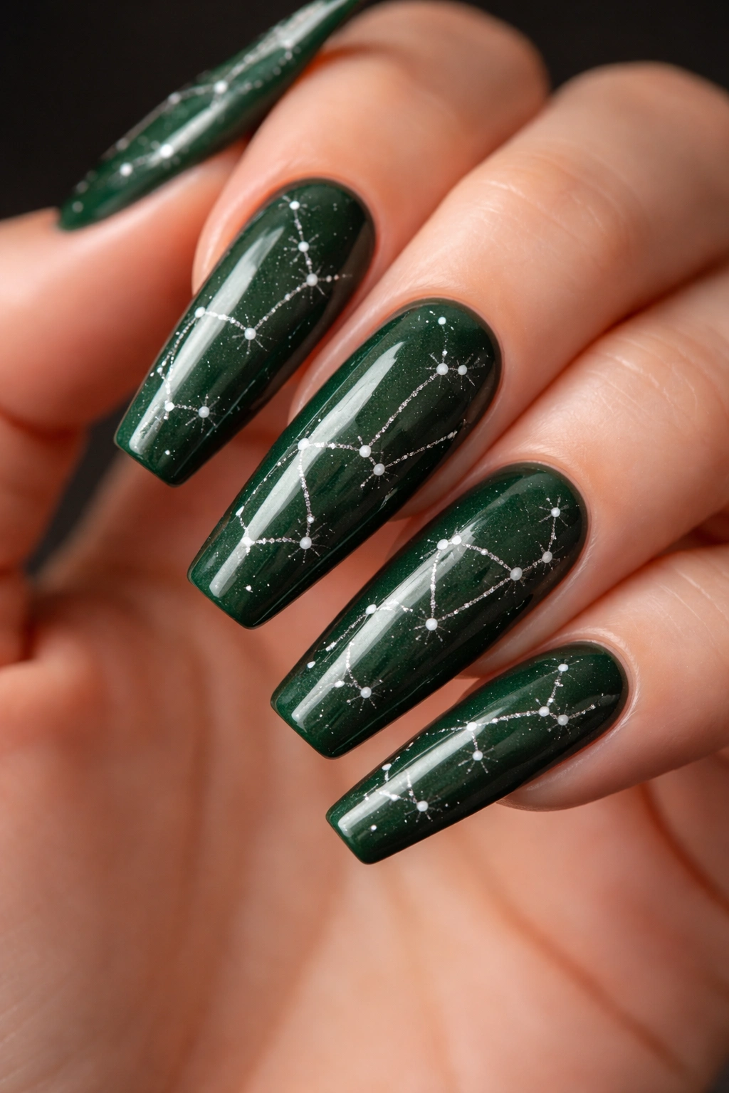 Forest-green glossy coffin nails with constellation dot pattern