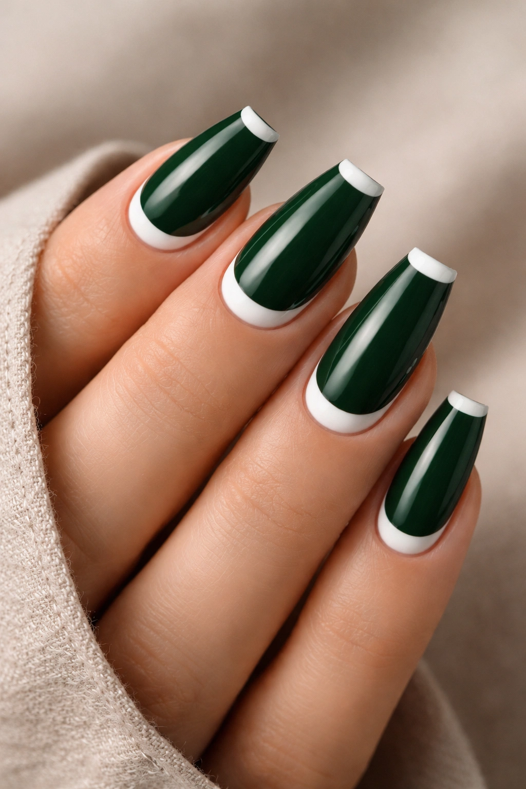 Nails deep forest green with white reverse French tip