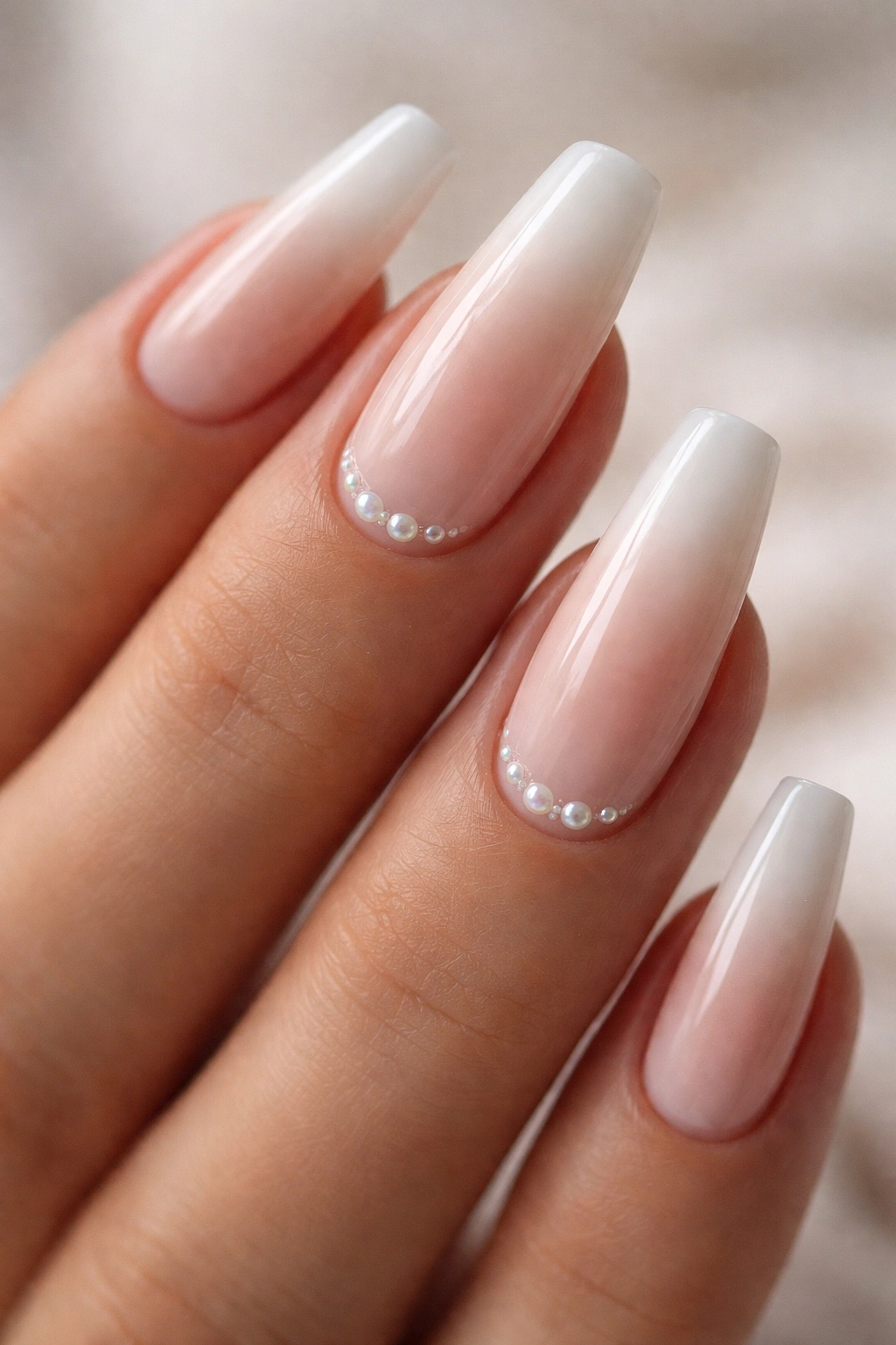 French fade ballerina nails with micro pearls near cuticle