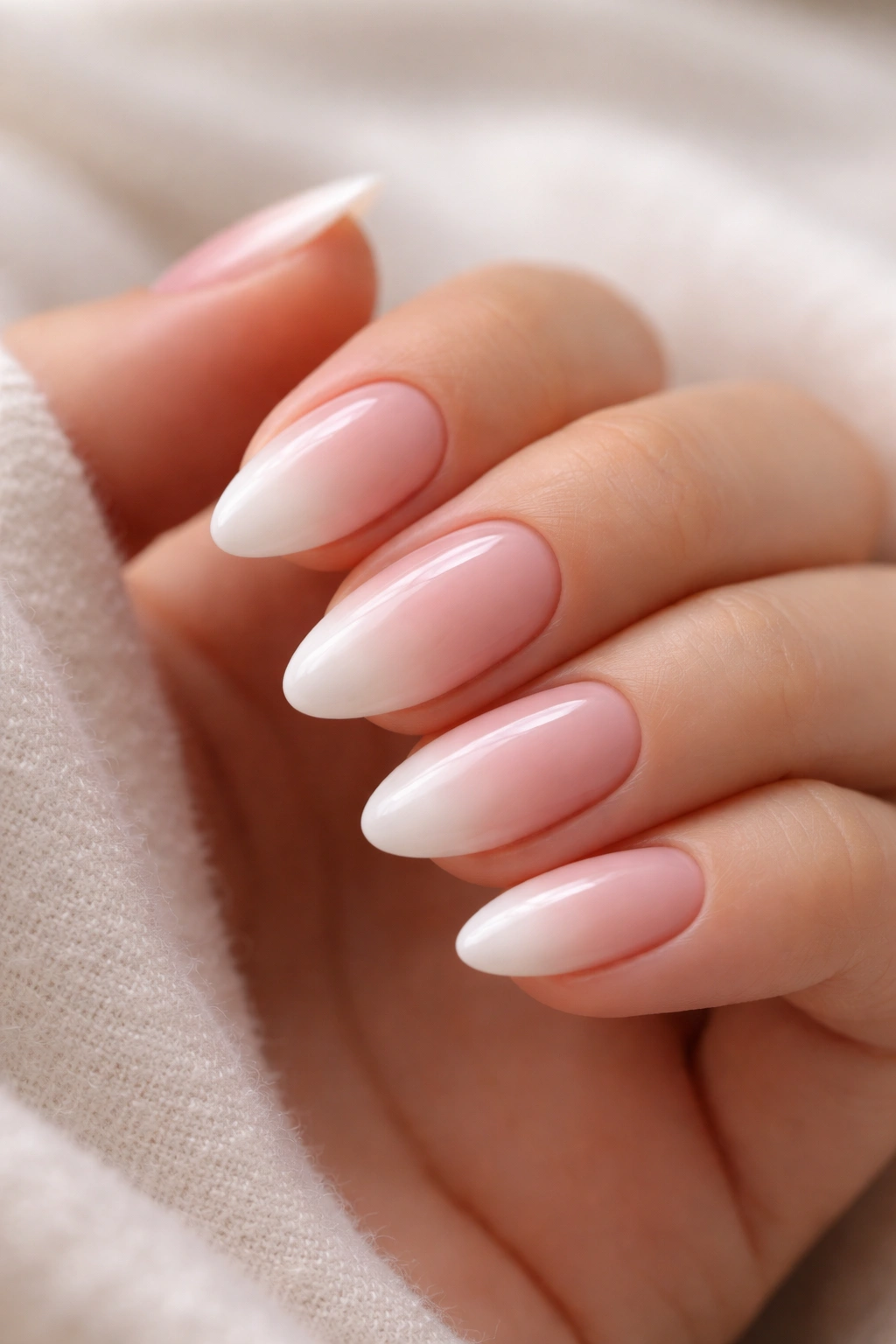 Pink almond nails with a soft cloud-like cloudy tip