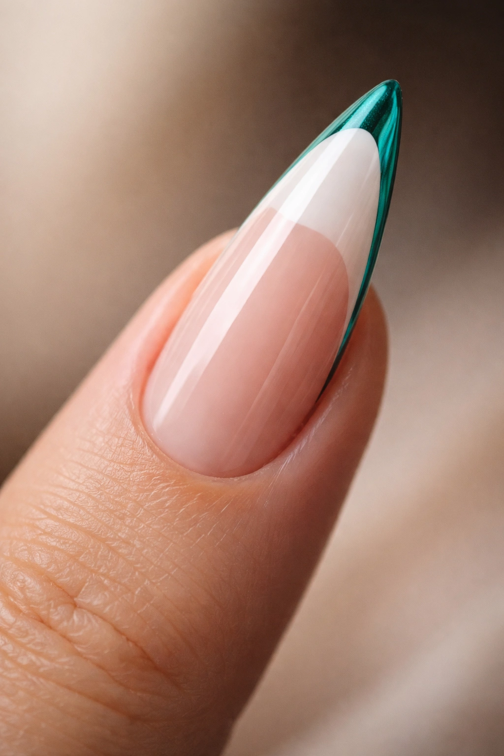 Stiletto nail with white French tip and thin colored edge above the tip