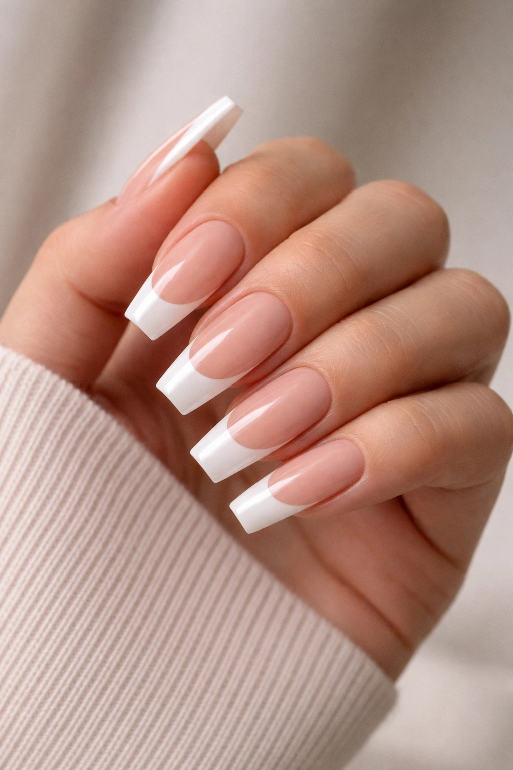 Coffin nails with nude base and extended white French tips