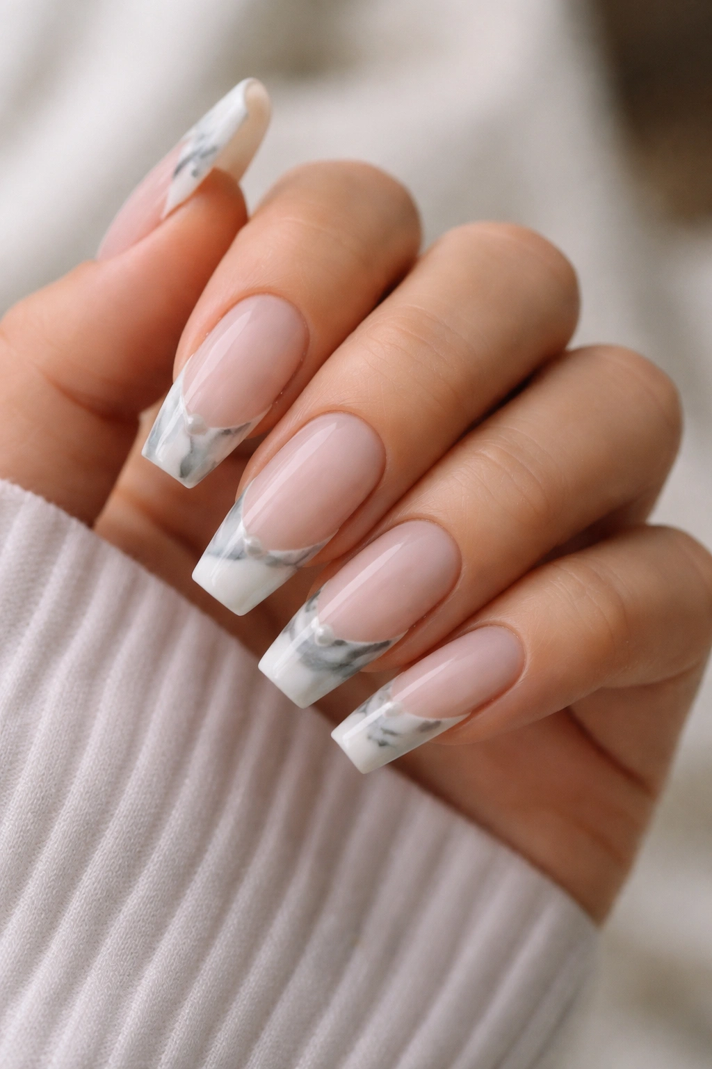French tip marble ballerina nails on nude base with diagonal marble tips