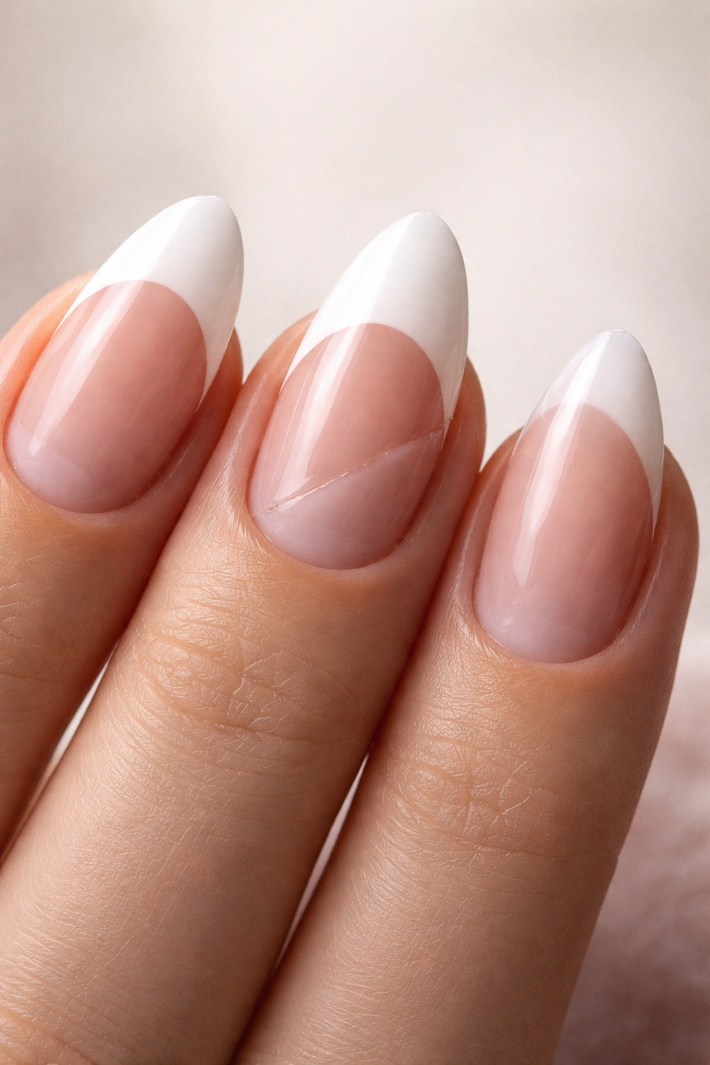 Close-up of almond nails with thick tips and uneven shapes illustrating common mistakes