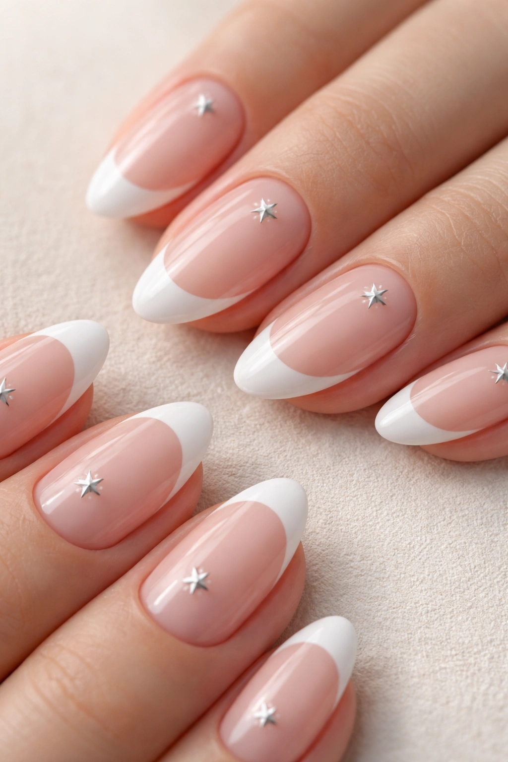 Almond nails with French tip and single star on each nail