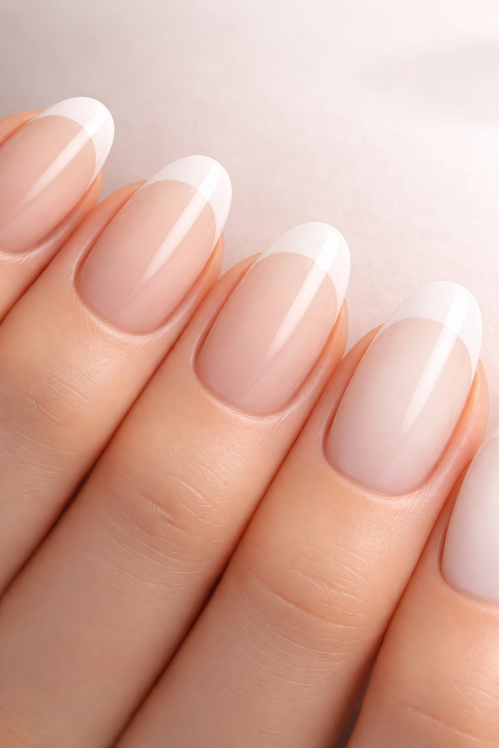 Nails with French tips of varying widths and whites