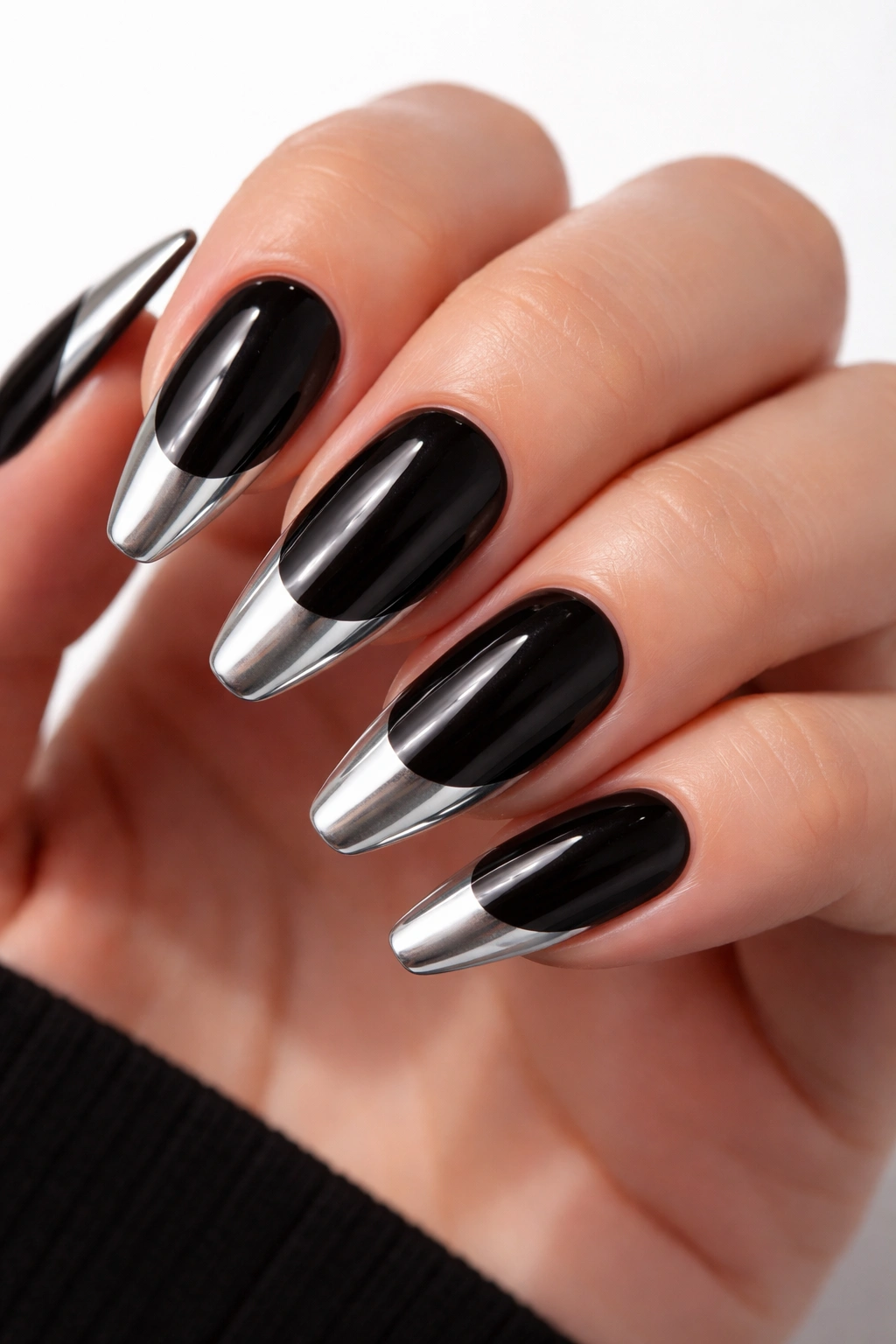 Close-up of black nails with white chrome French tips