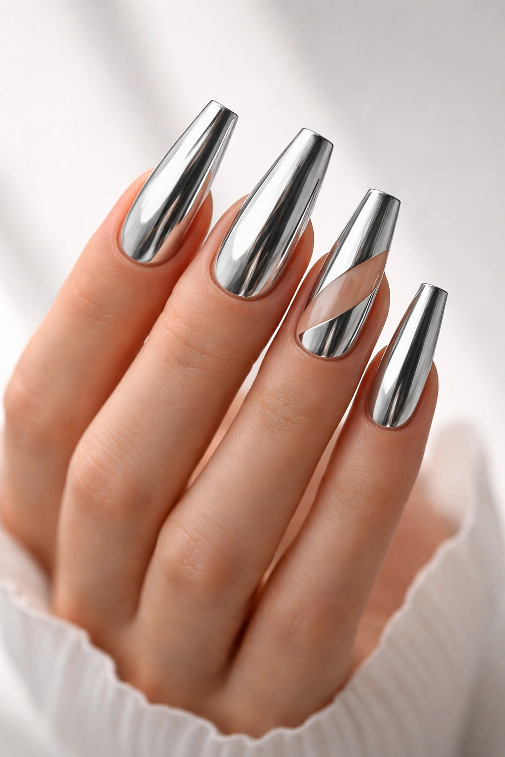 Chrome coffin nails with two natural negative space accents
