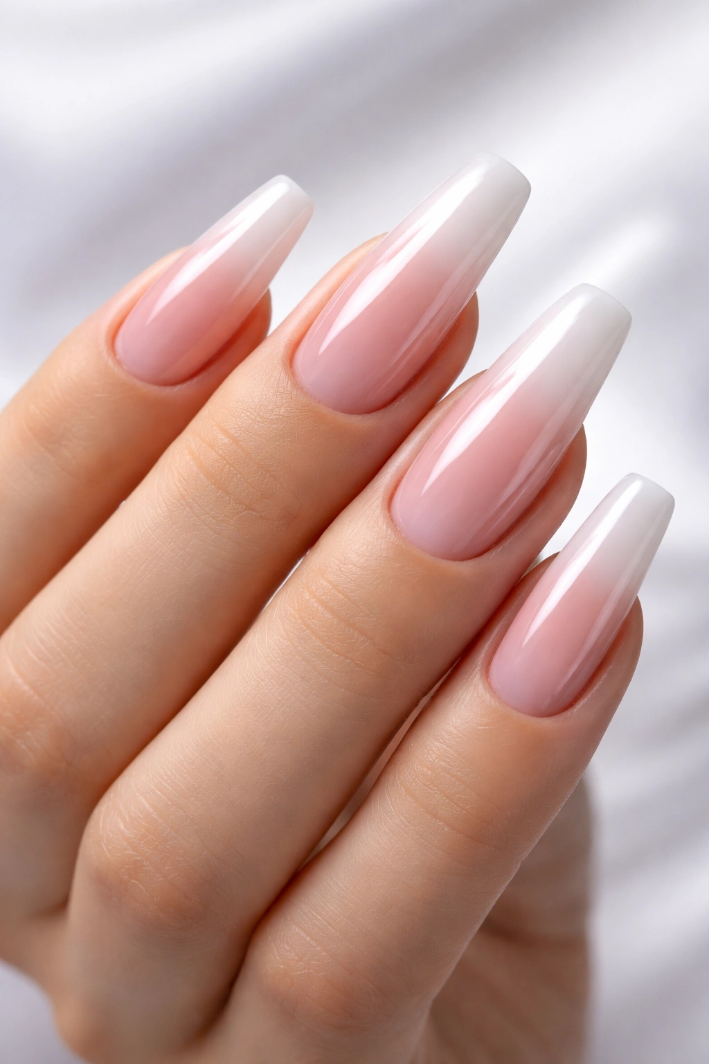 Close-up of hand with long glossy gel-polish nails