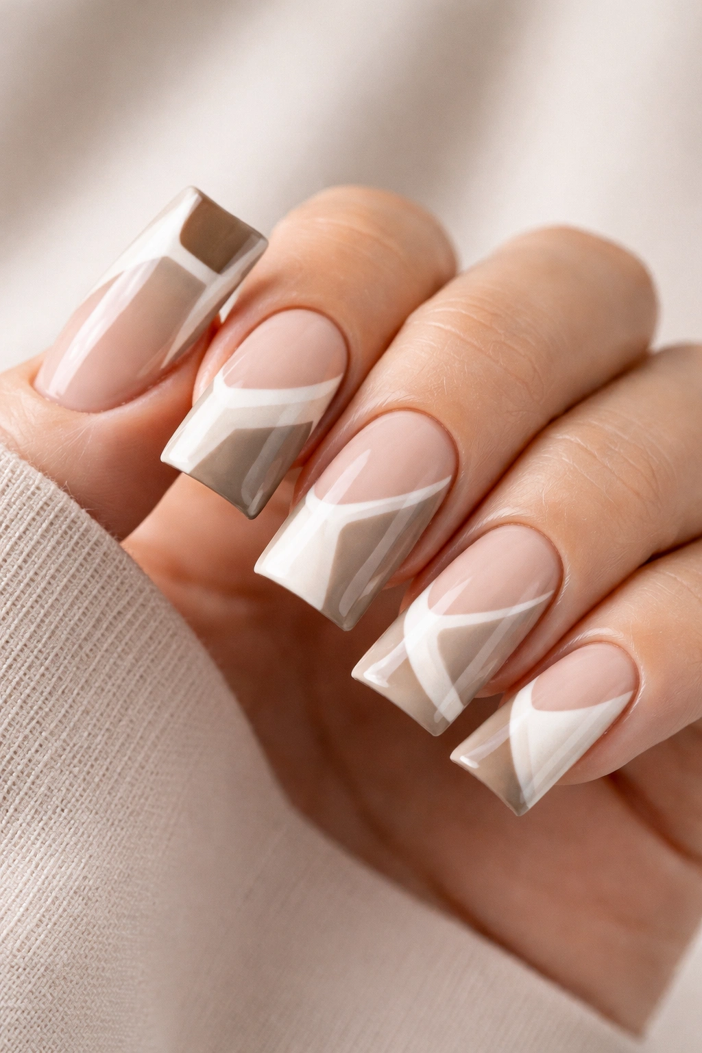 Minimalist geometric duck nails with crisp lines along curved nails