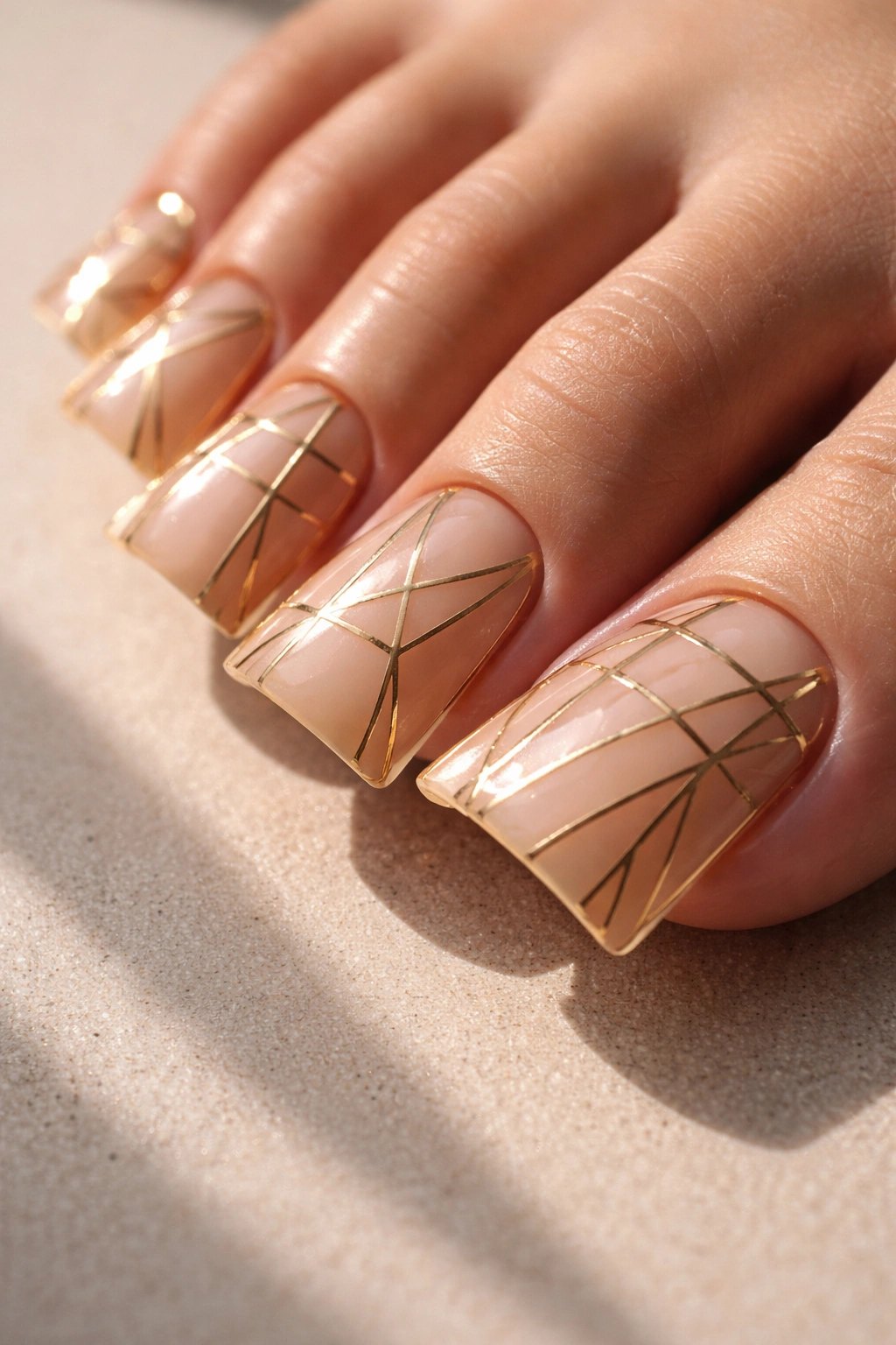 Geometric gold line nails on duck nails toes