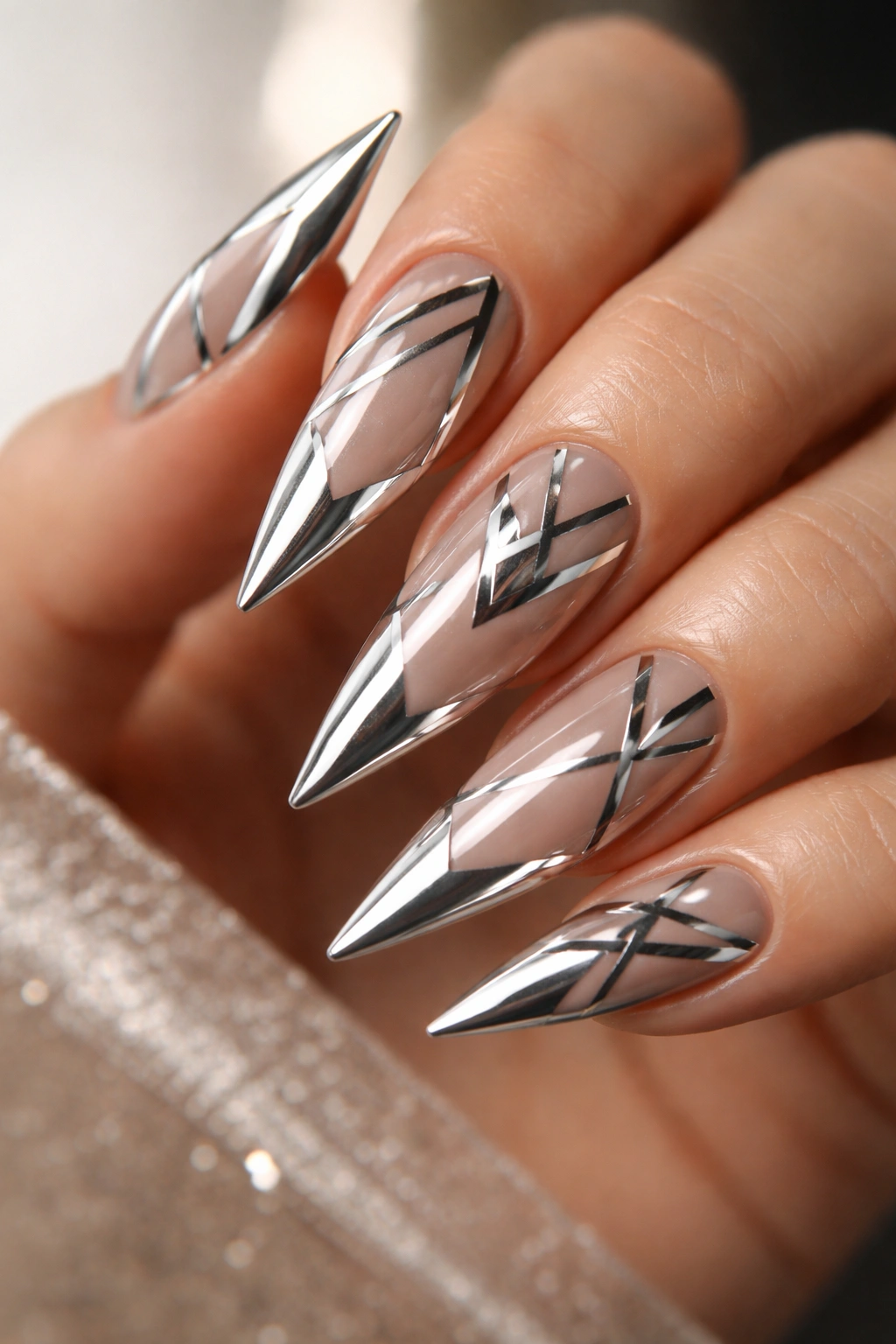 Stiletto nails with chrome geometric patterns