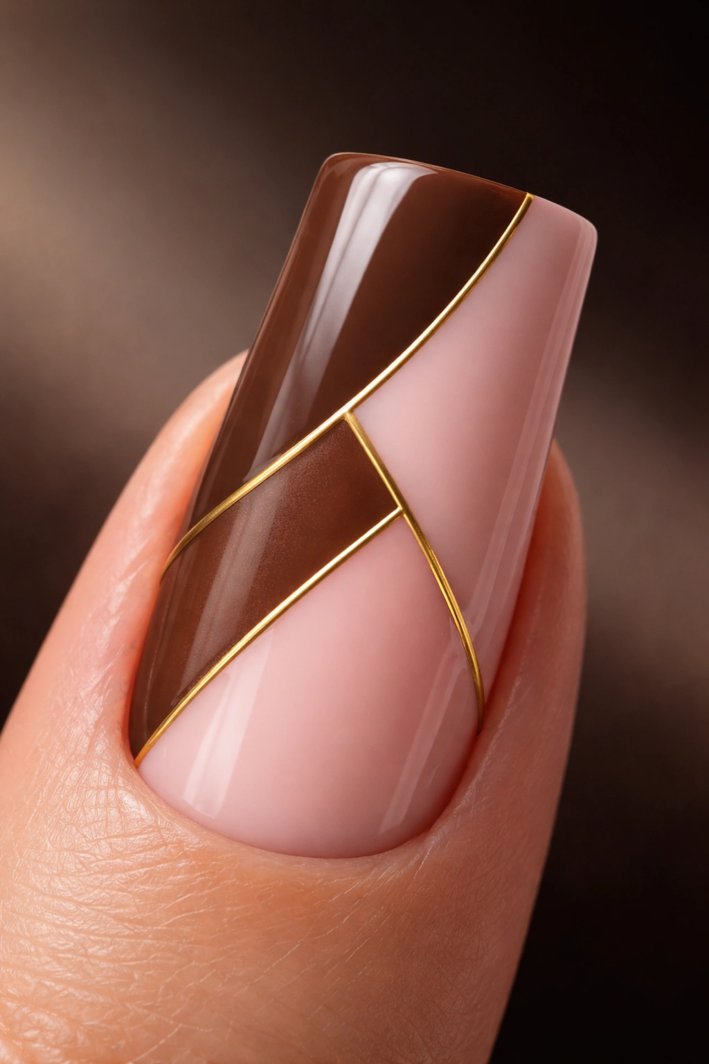 Duck nail with brown and pink color blocks and thin gold dividers