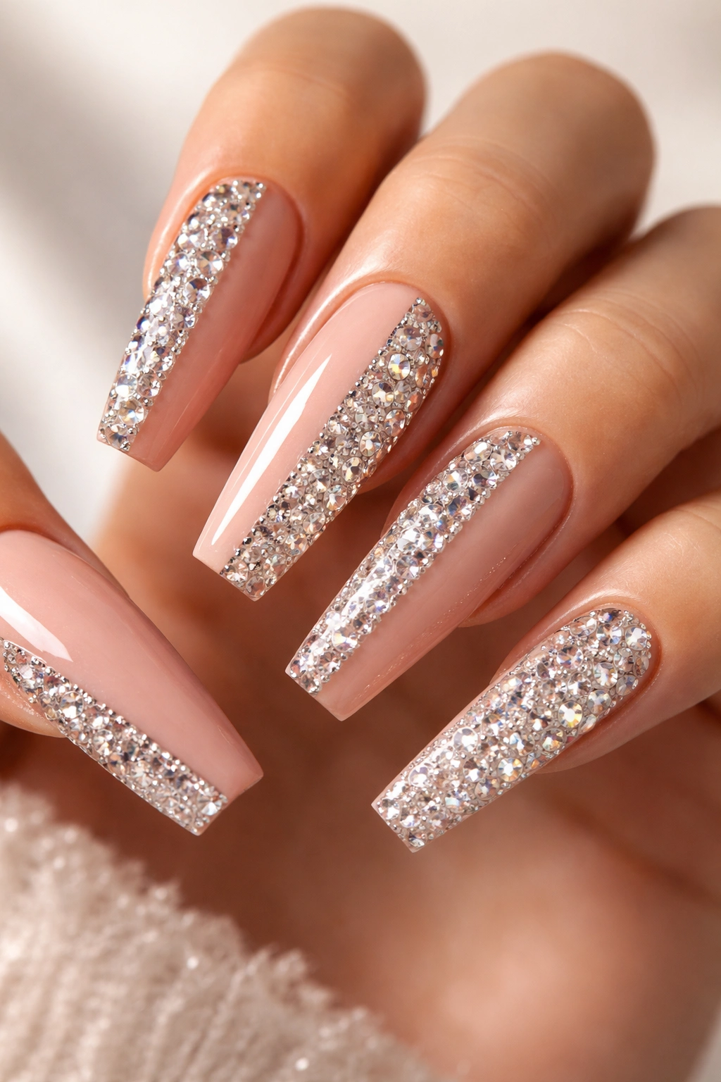 Coffin nails showing a half-and-half split with rhinestones on one side and solid color on the other