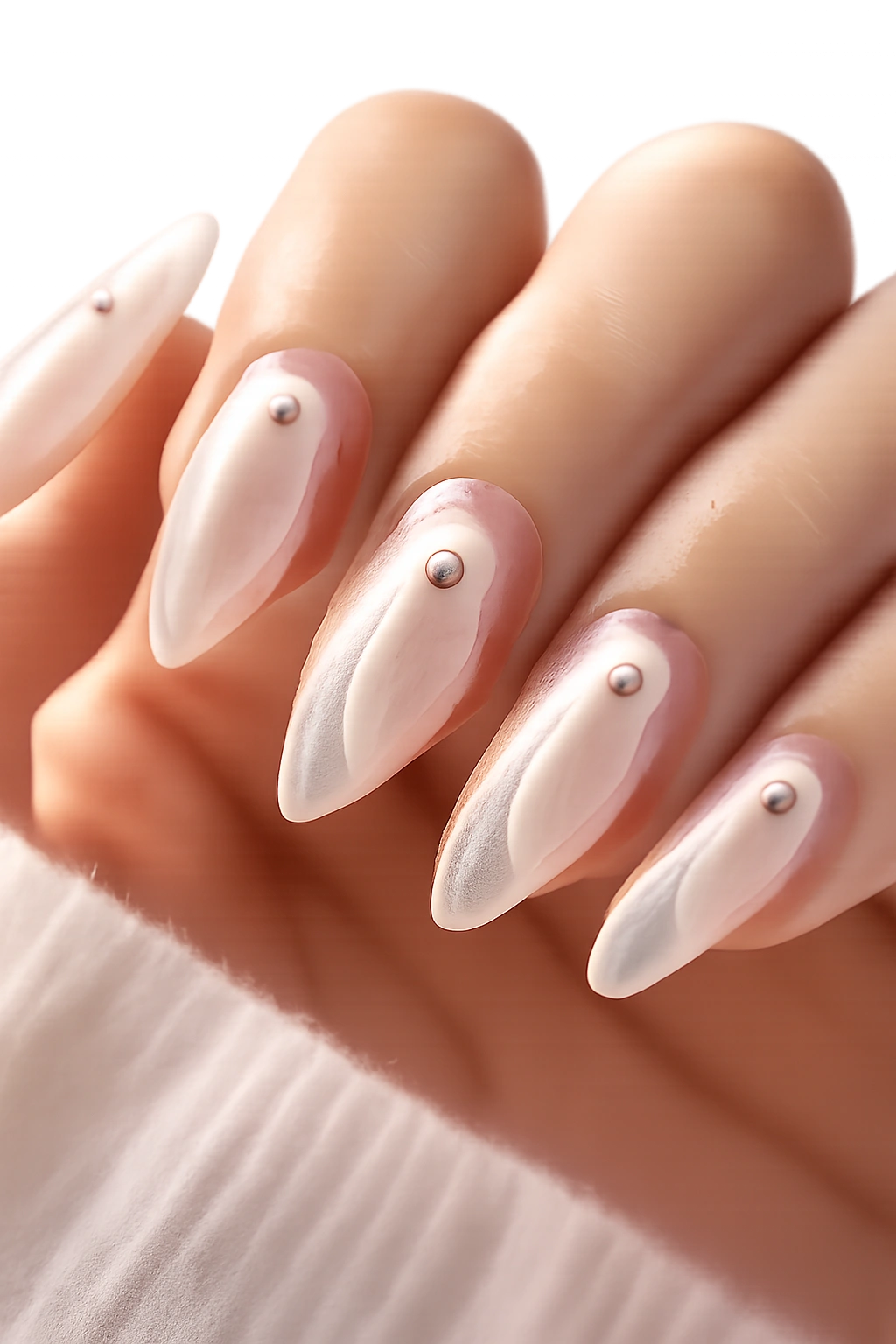 Almond nails with translucent white ghost silhouettes on a nude base