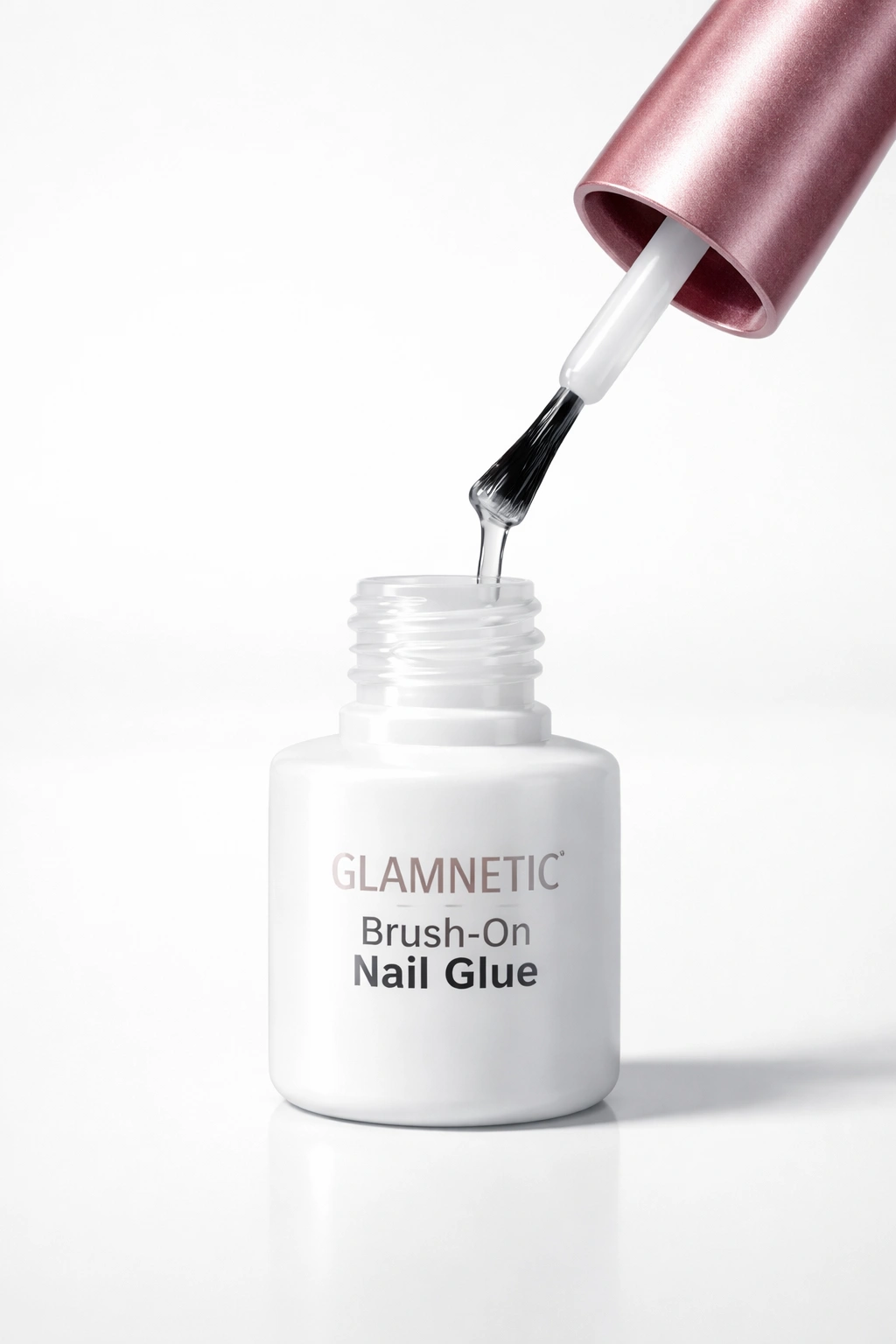 Glamnetic brush-on nail glue bottle close-up