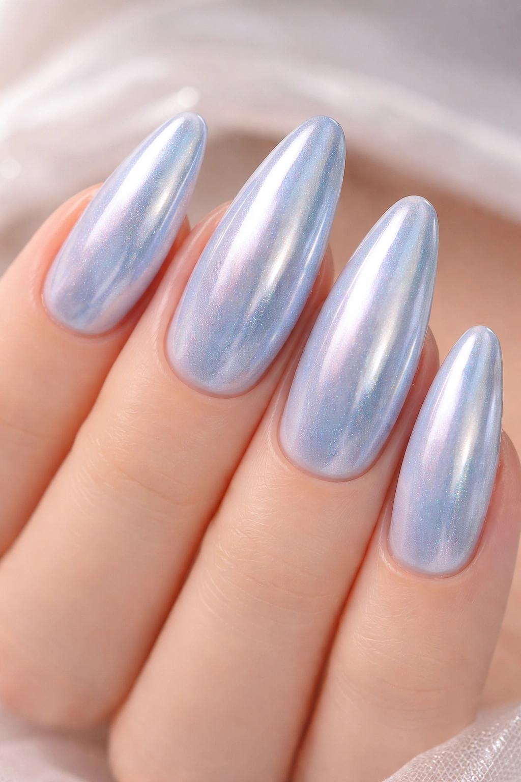 Close-up of Cinderella's Glass Slipper Chrome nails displaying pale blue base with iridescent chrome sheen