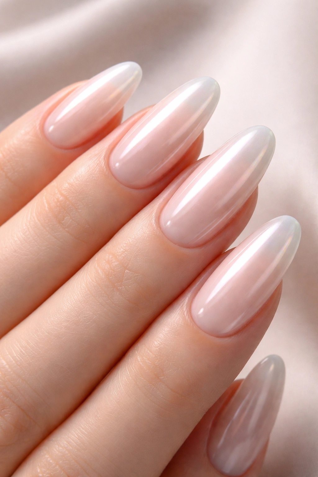 Long oval nails with glazed, glossy translucent finish