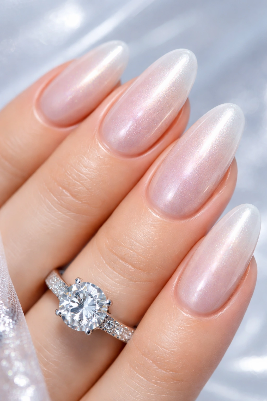 Nails with pearlescent glaze catching light in a soft studio setting