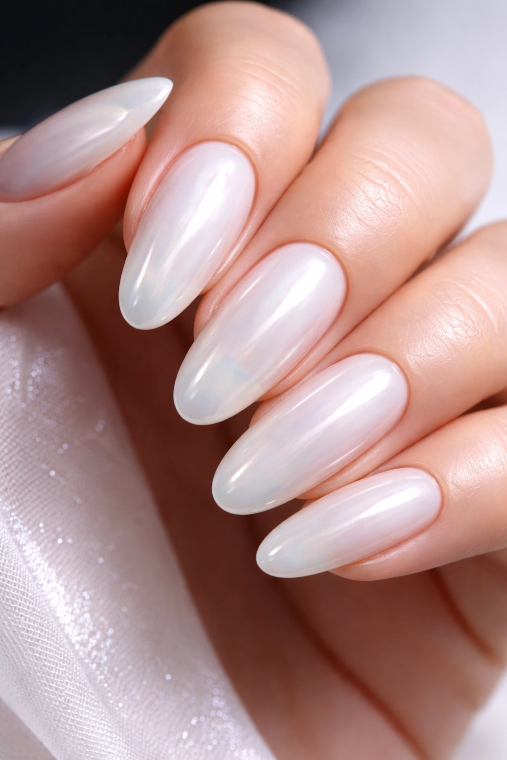 Glossy glazed white nails with a thick translucent finish
