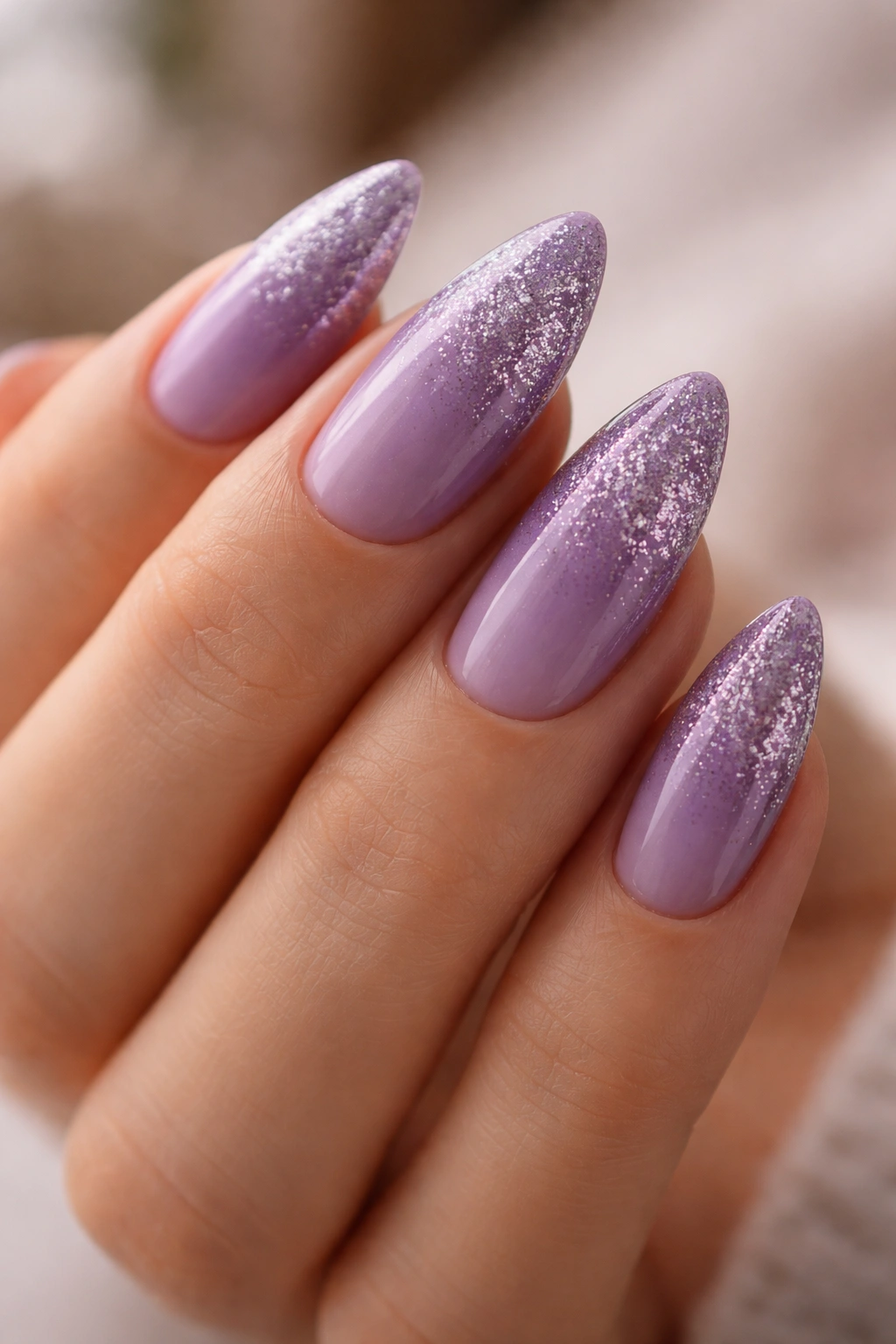 Glitter fade purple almond nails with subtle sparkle