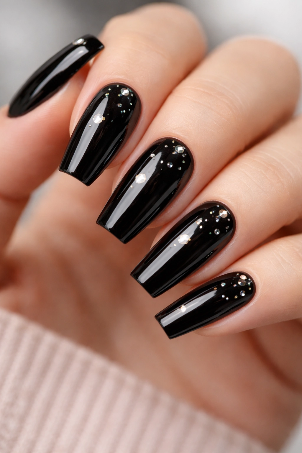 Coffin nails with glossy black base and scattered tiny crystal accents