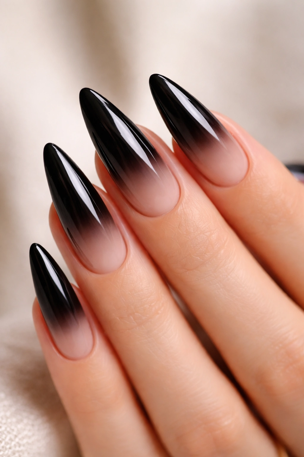 Ultra-long almond nails with deep black ombre and mirror gloss