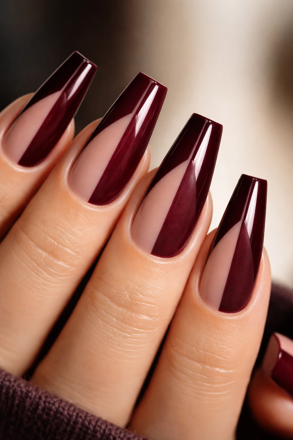 Coffin nails with burgundy tips showing glossy and matte contrast