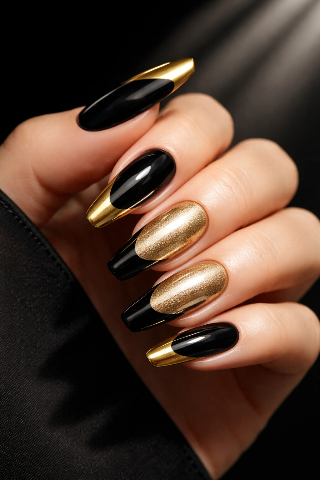 Nails with black base and gold tips for dramatic contrast