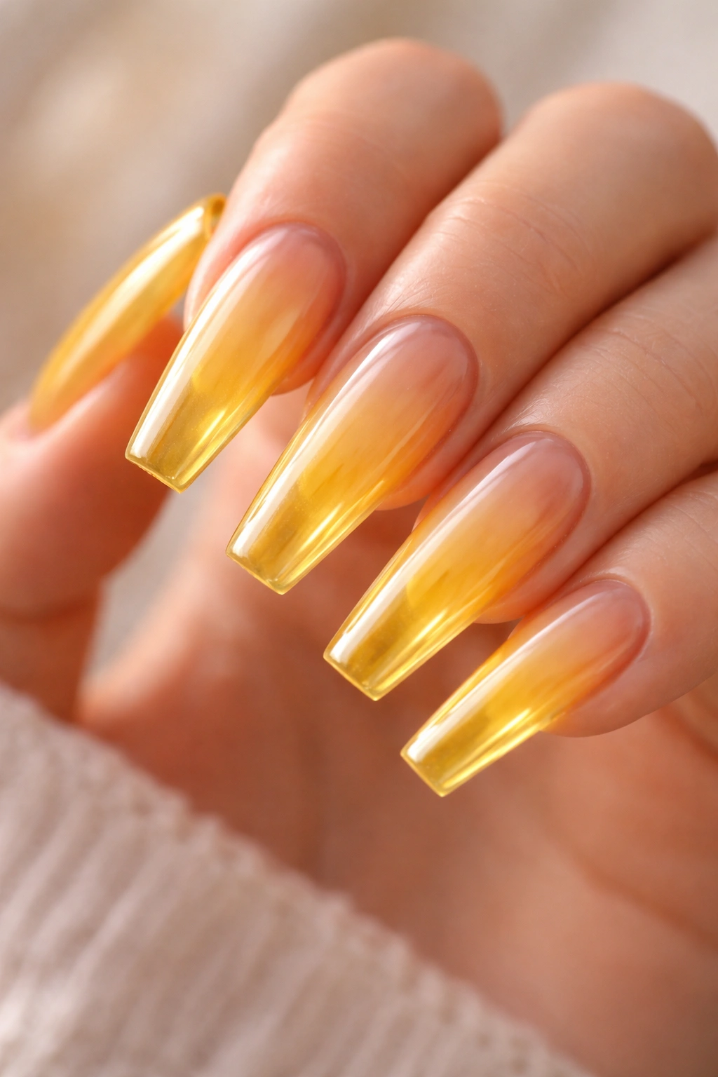 Translucent golden jelly coffin nails showing nail bed