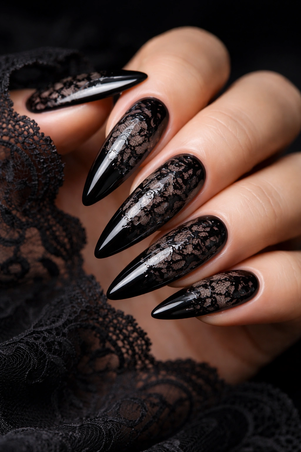 Close-up of gothic lace overlay nails on black base