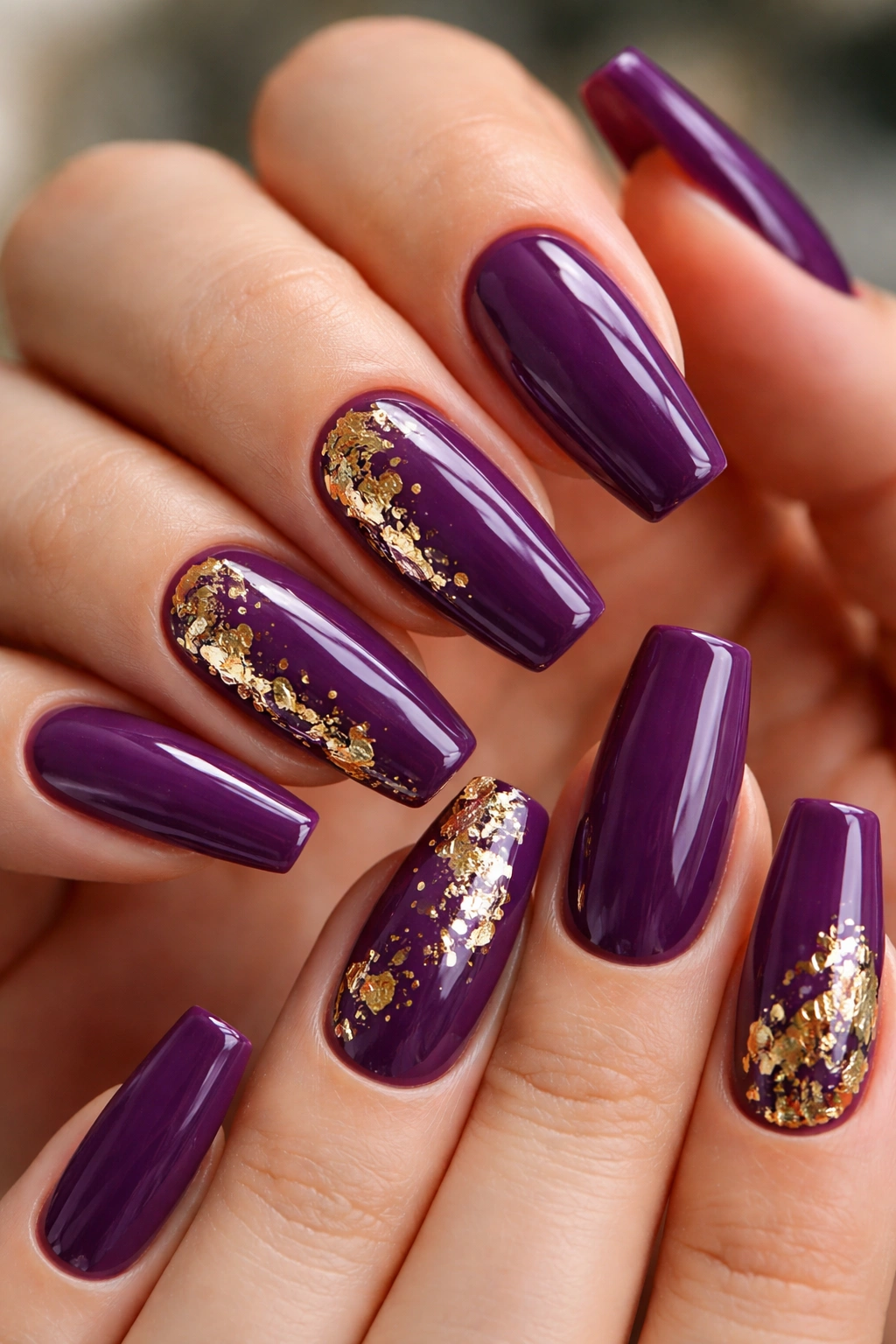 Grape purple nails with gold foil shards on accent nails