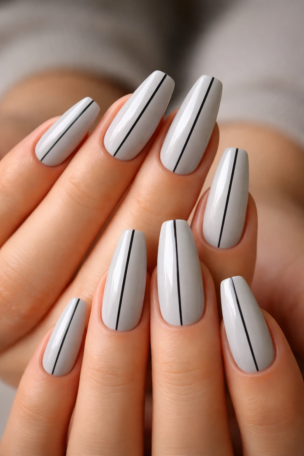 Soft gray coffin nails with a single black line