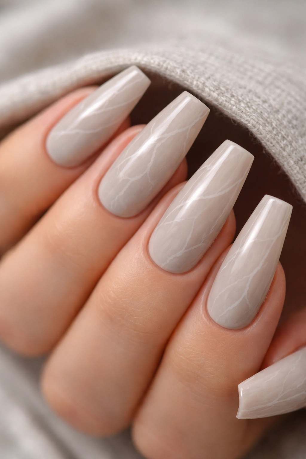 Greige marble nails with fine white veining on ballerina nails
