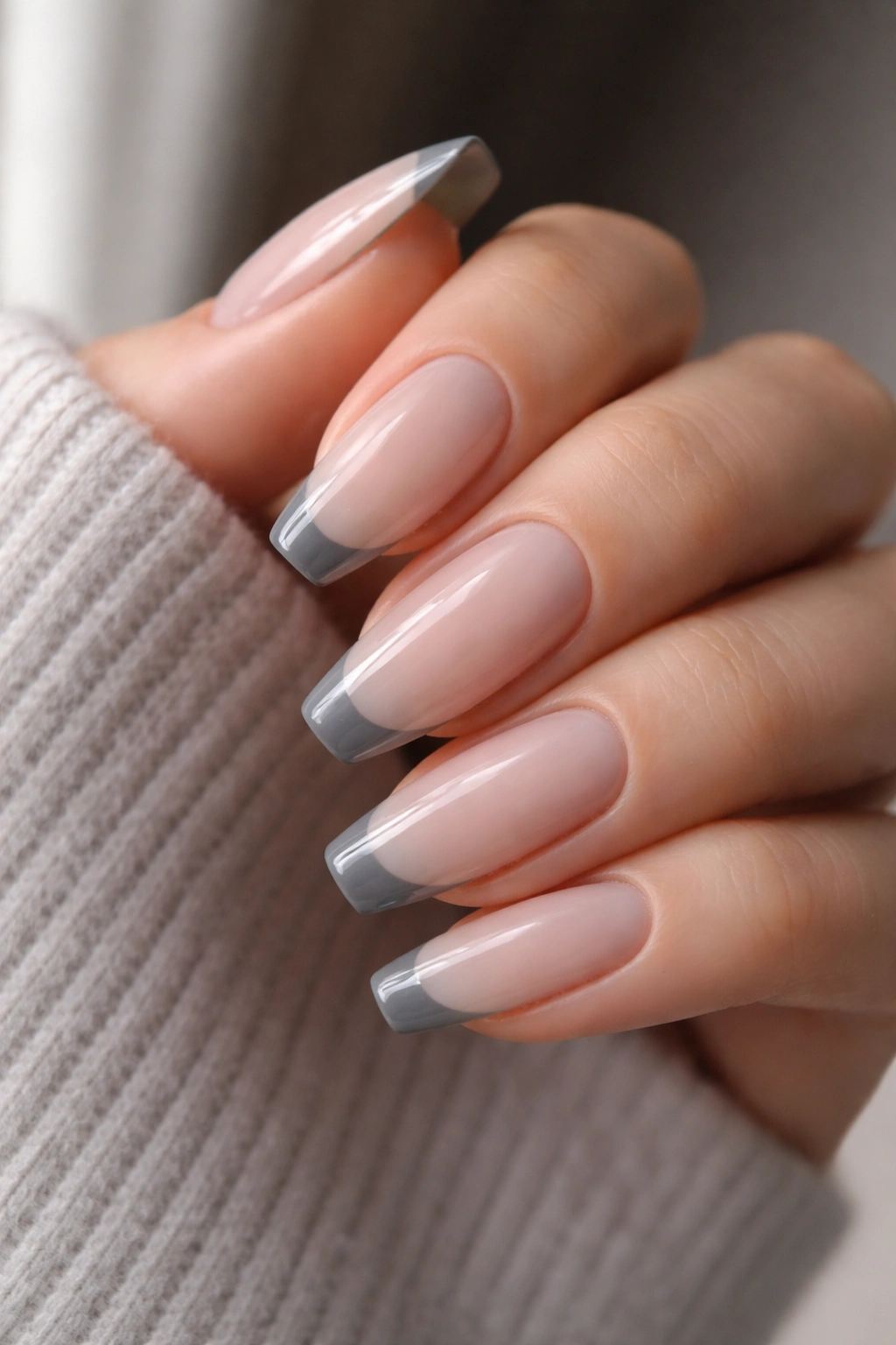 Nails with sheer base and grey micro-French tips on long ballerina nails