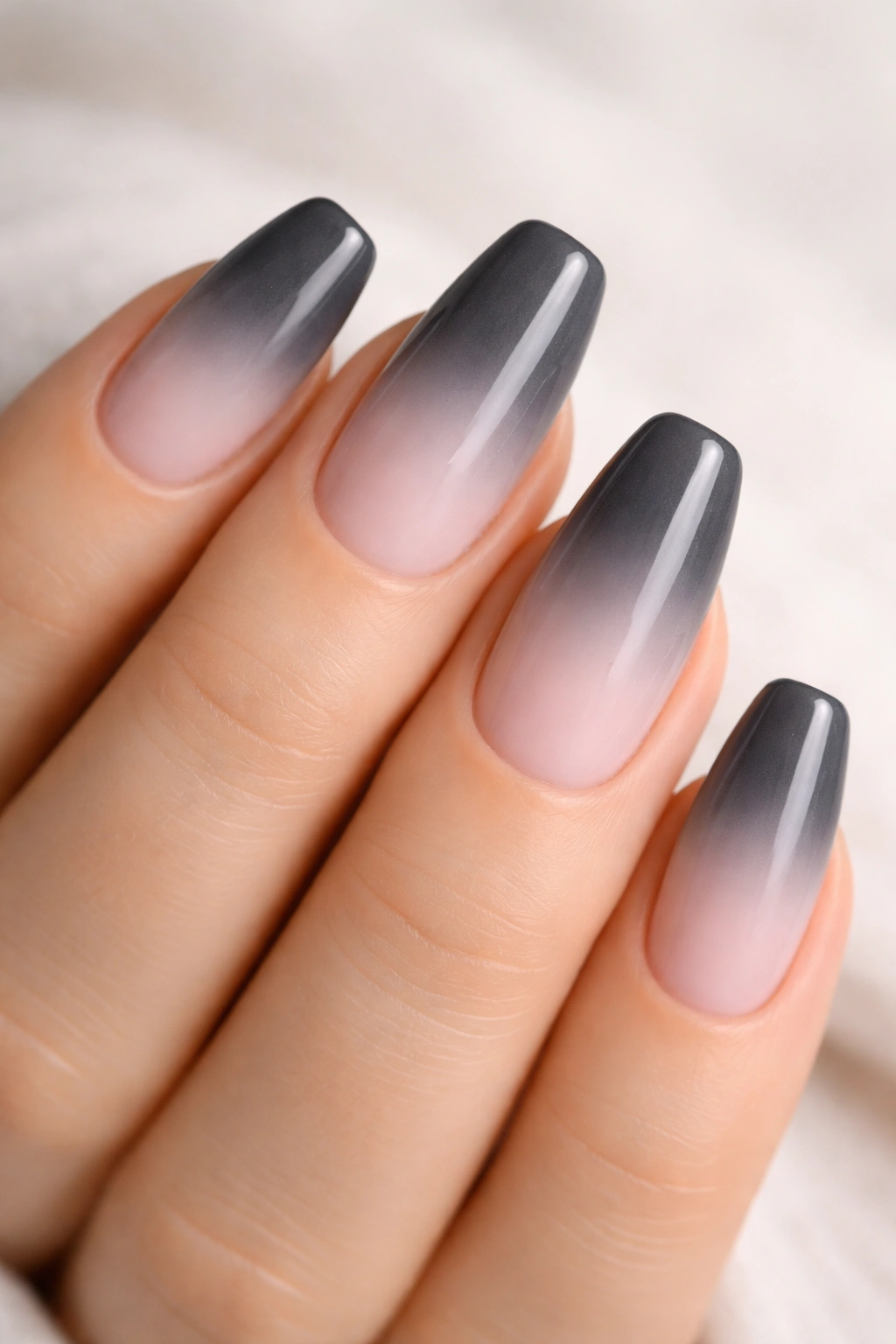 Grey ombre nails fading into pastel pink