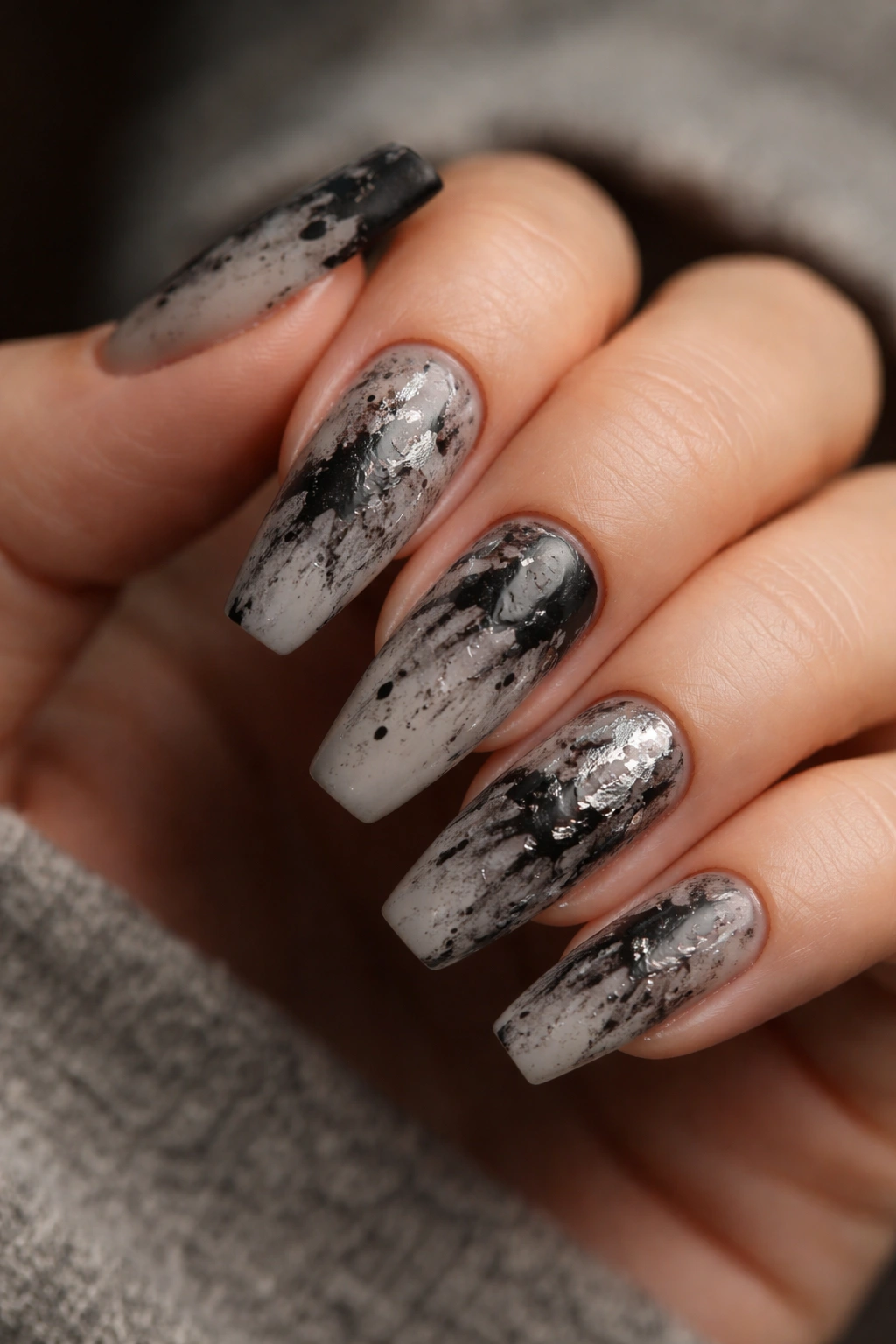 Grunge ink-splatter nails with smoky base and black splatters