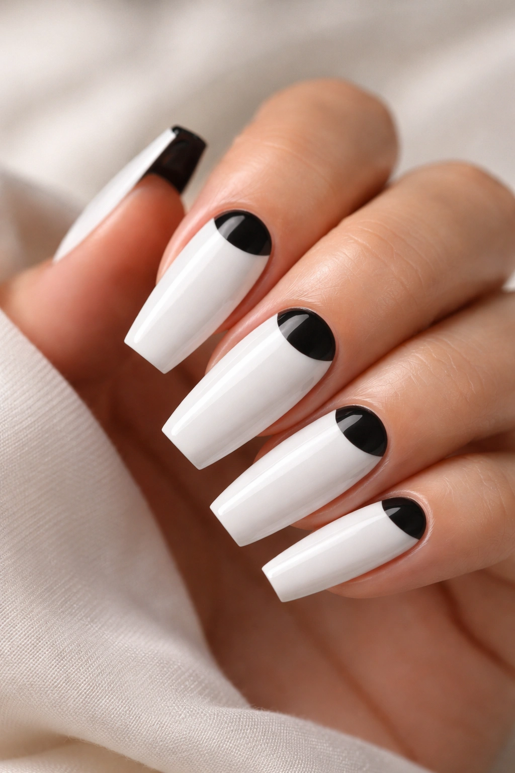 Coffin nails featuring a black half-moon at the base on a white base