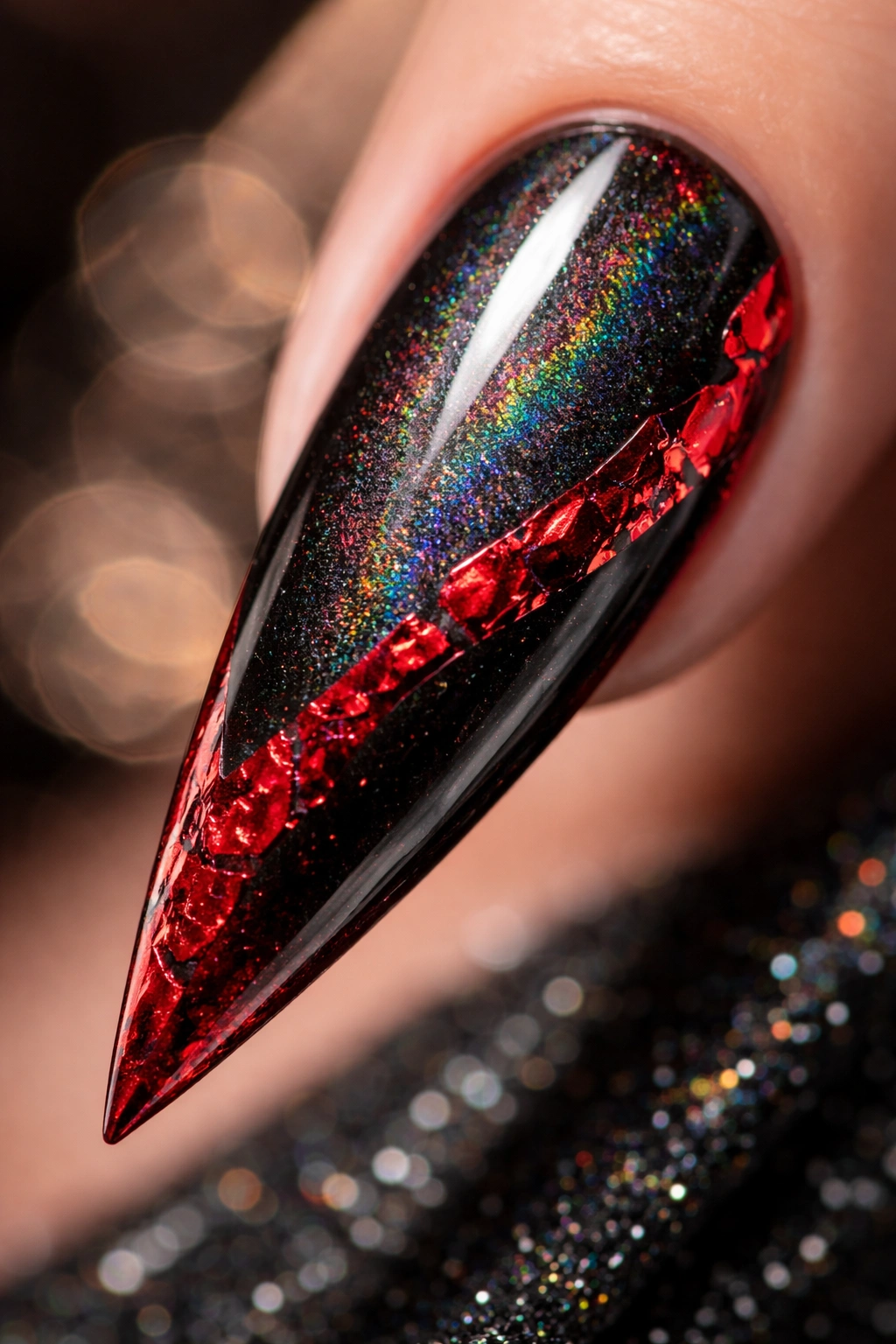 Stiletto nail with holographic black finish and red foil accents