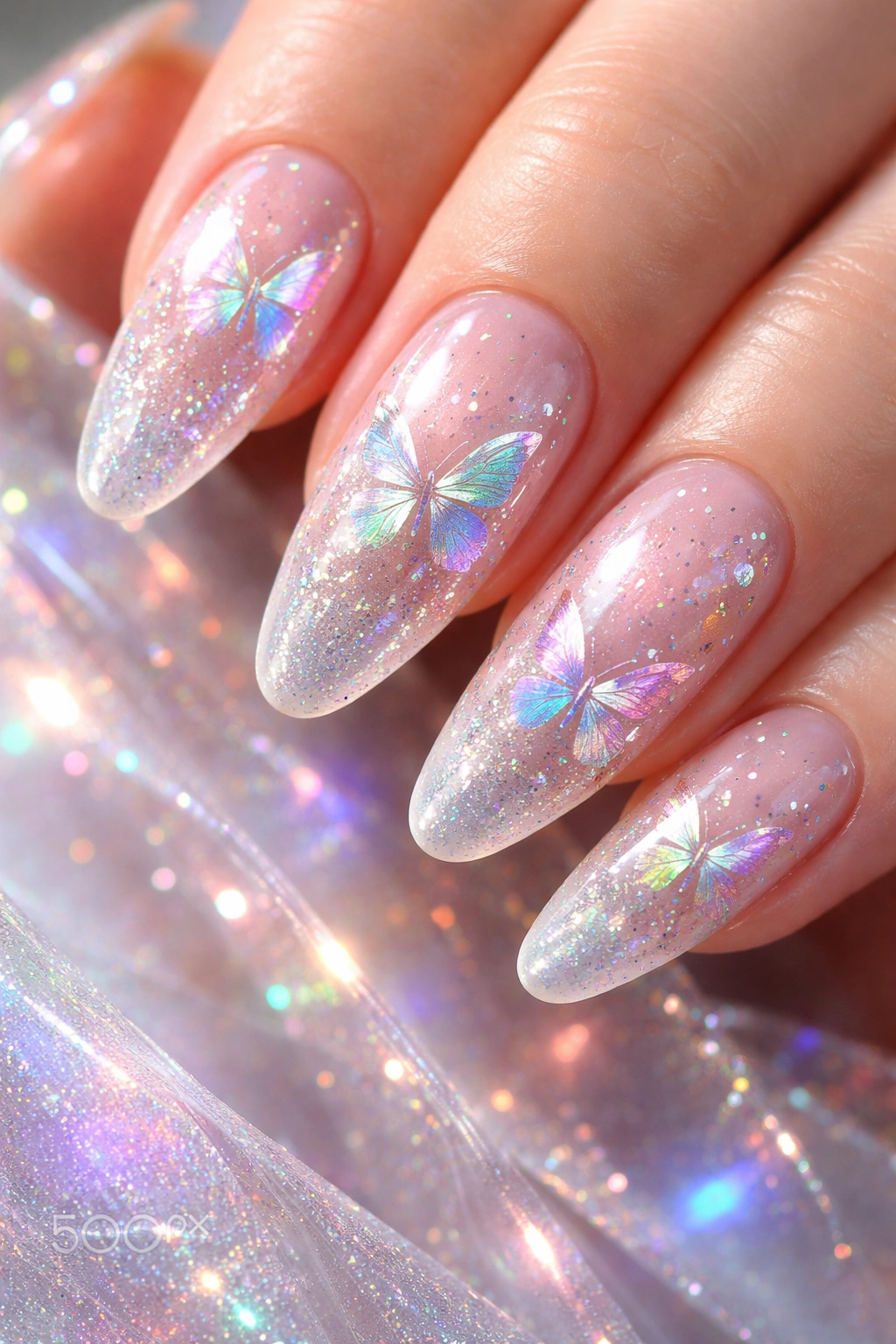 Nails with holographic shimmer and butterfly shapes on neutral base