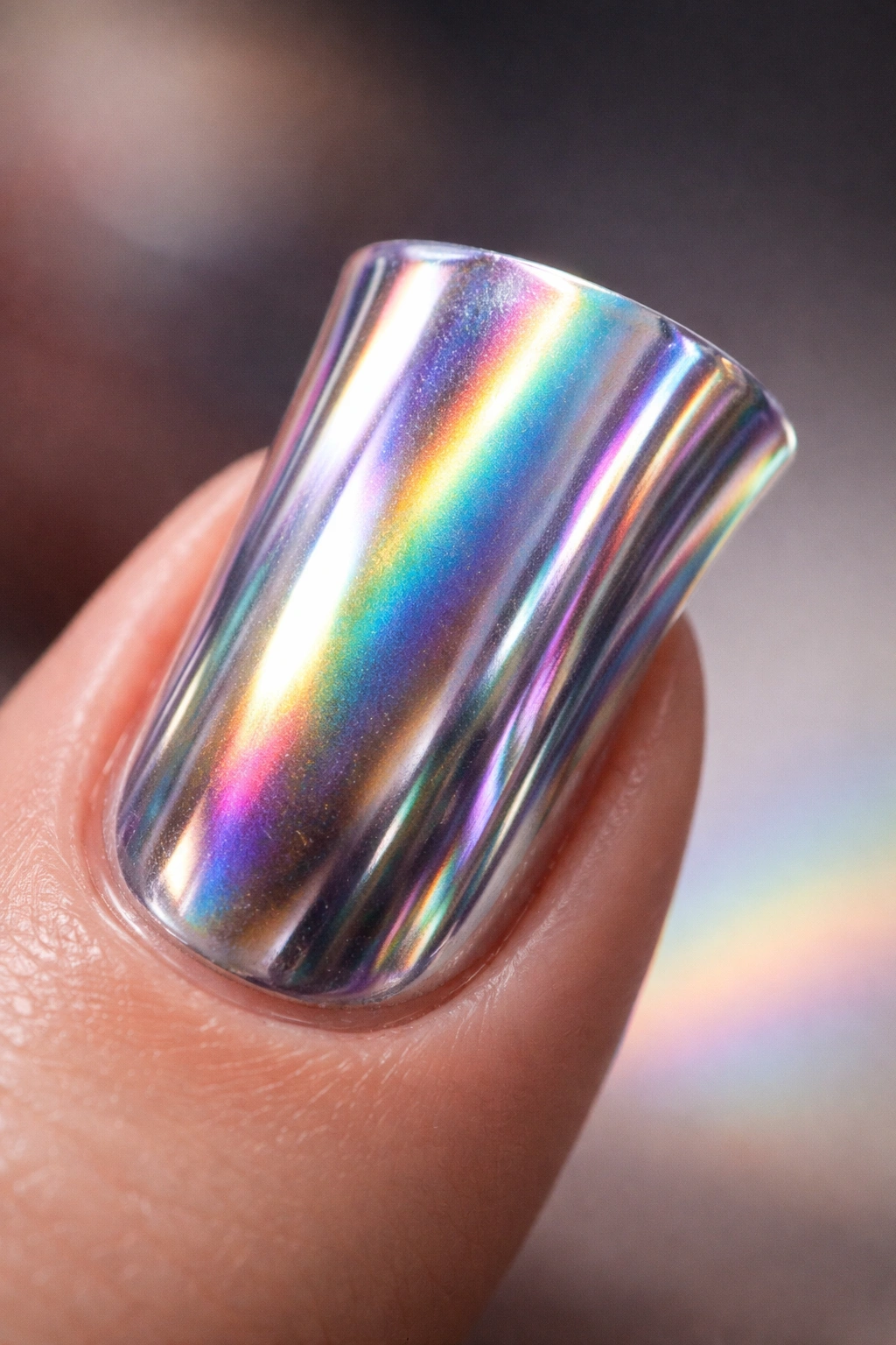 Duck nail with holographic chrome showing rainbow shifts under studio lighting