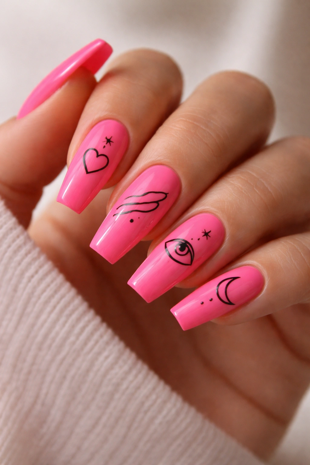 Hot pink coffin nails with minimalist line art and symbols.
