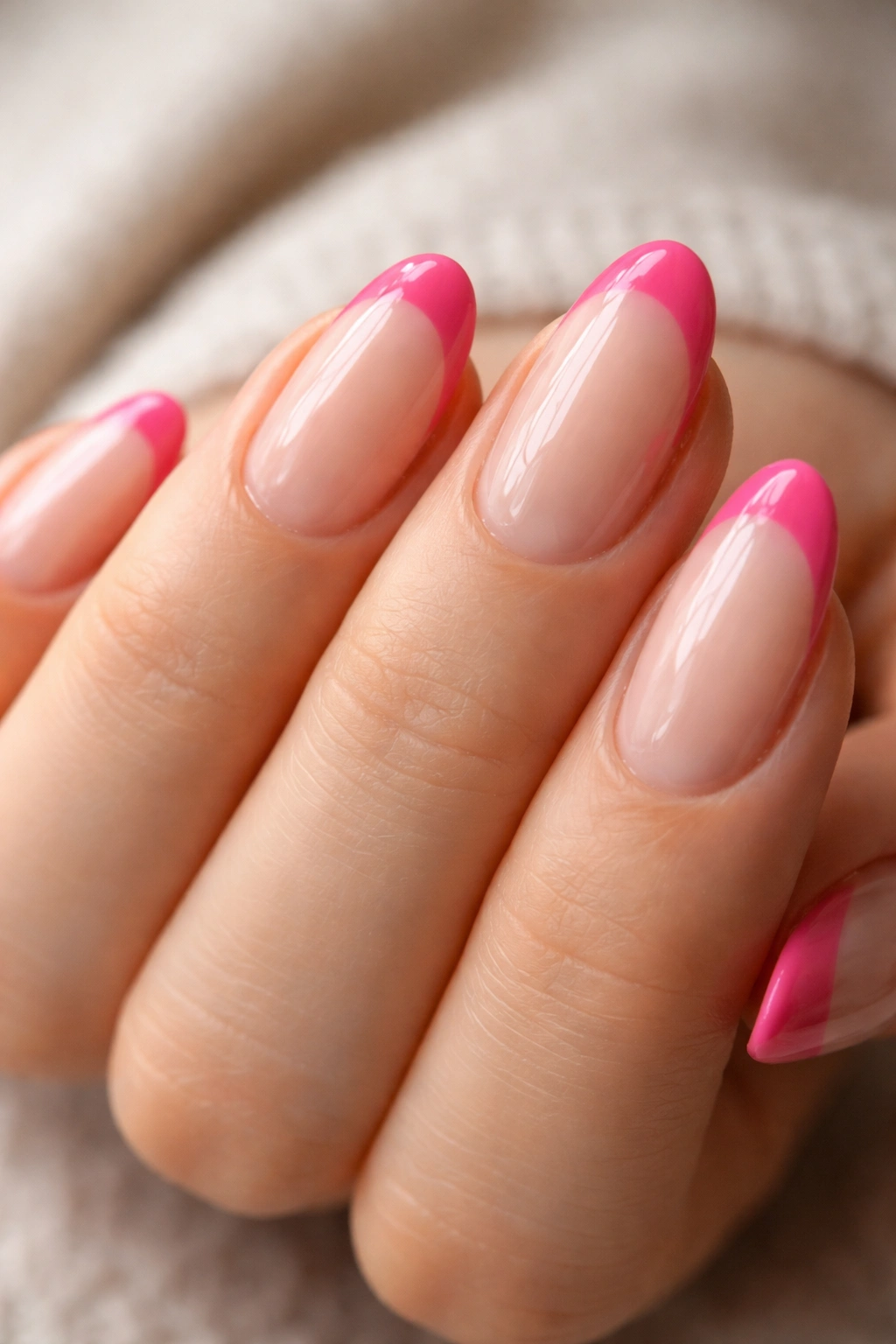 Natural nails with hot pink French tip and strengthening base coat.