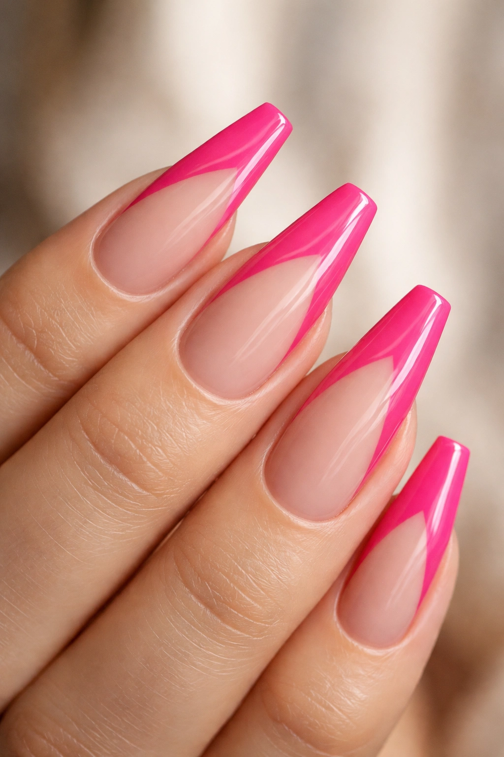 Close-up of a ballerina nail with hot pink side French and negative space