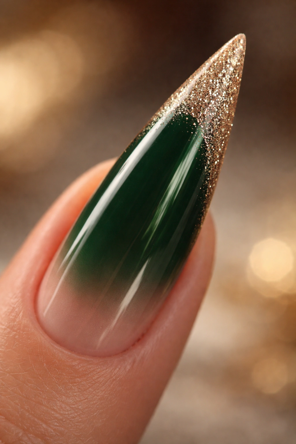 Hunter green stiletto nail with nude glitter tip.