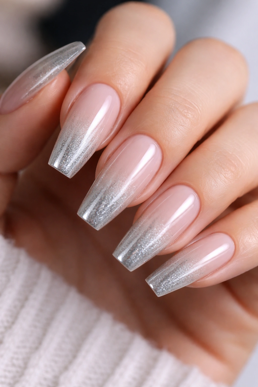 Nails with icy silver ombré fade from sheer to reflective