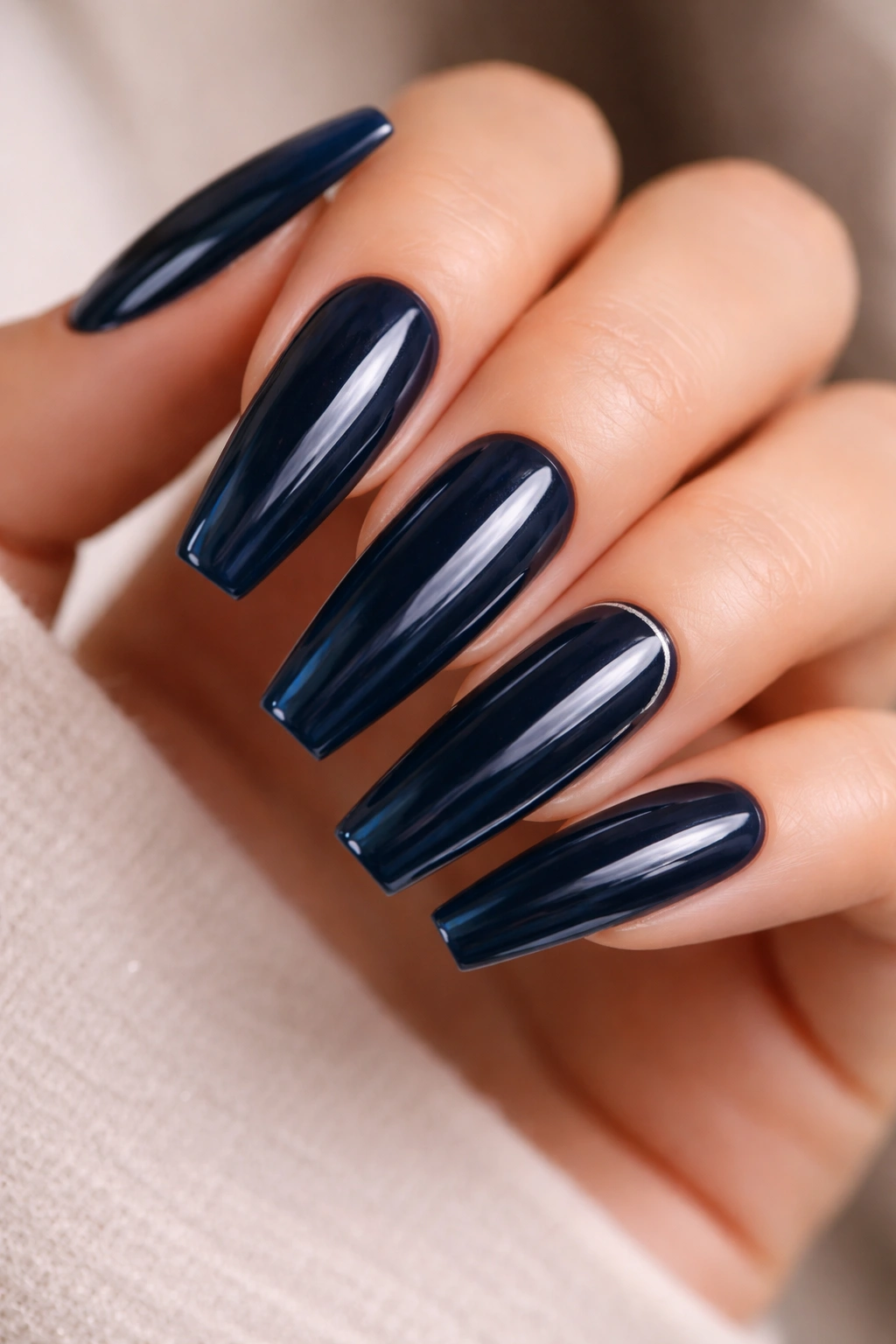 Long inky blue nails with glass-like high-shine finish