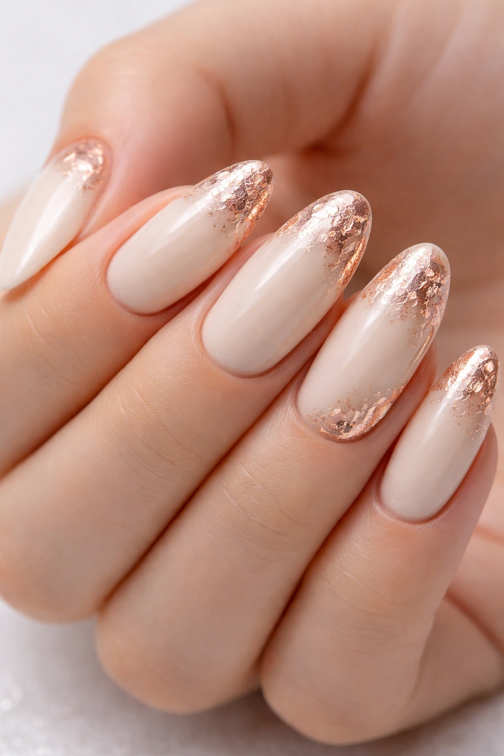 Ivory nails with rose gold foil accents