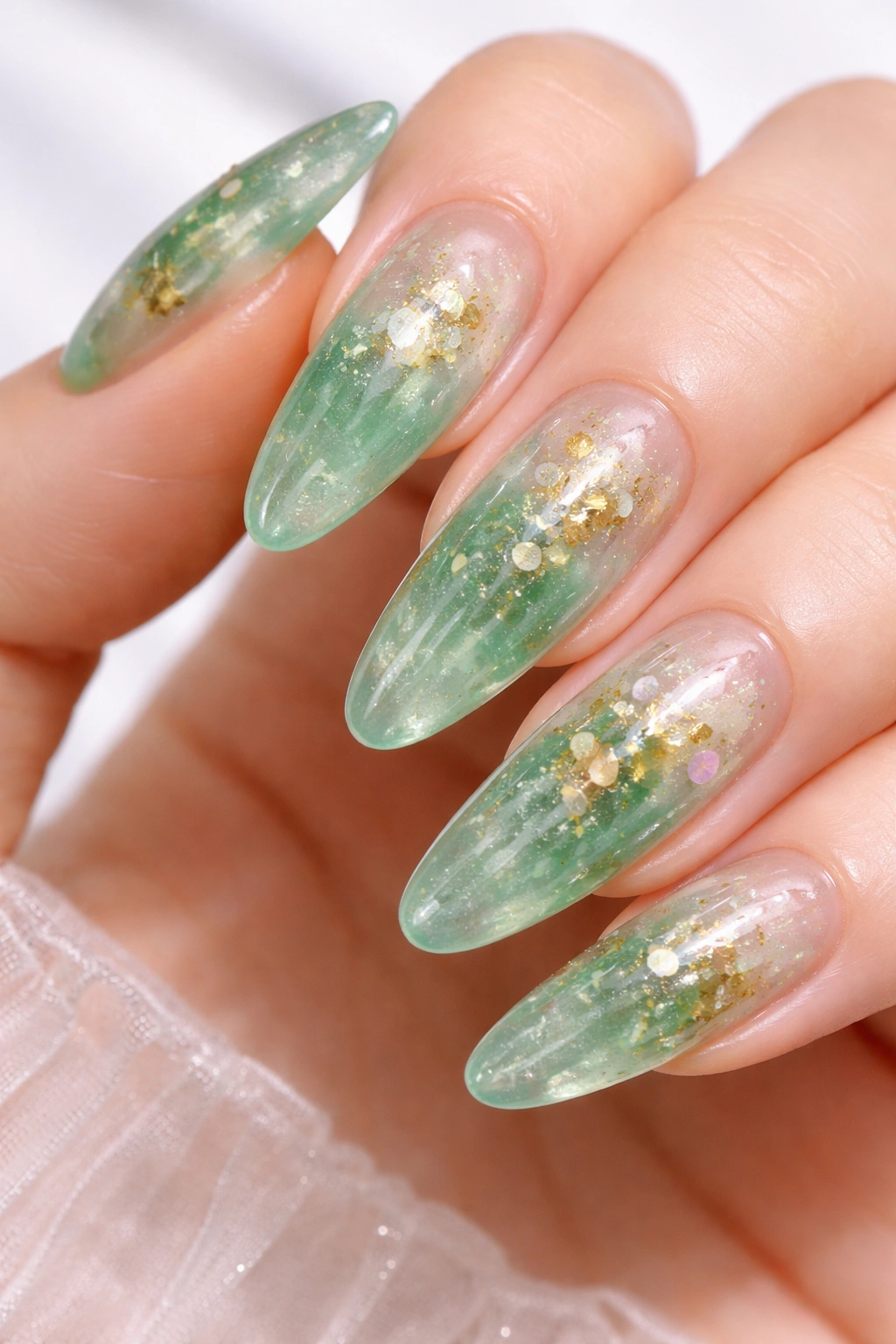 Jade jelly nails with translucent green and embedded elements